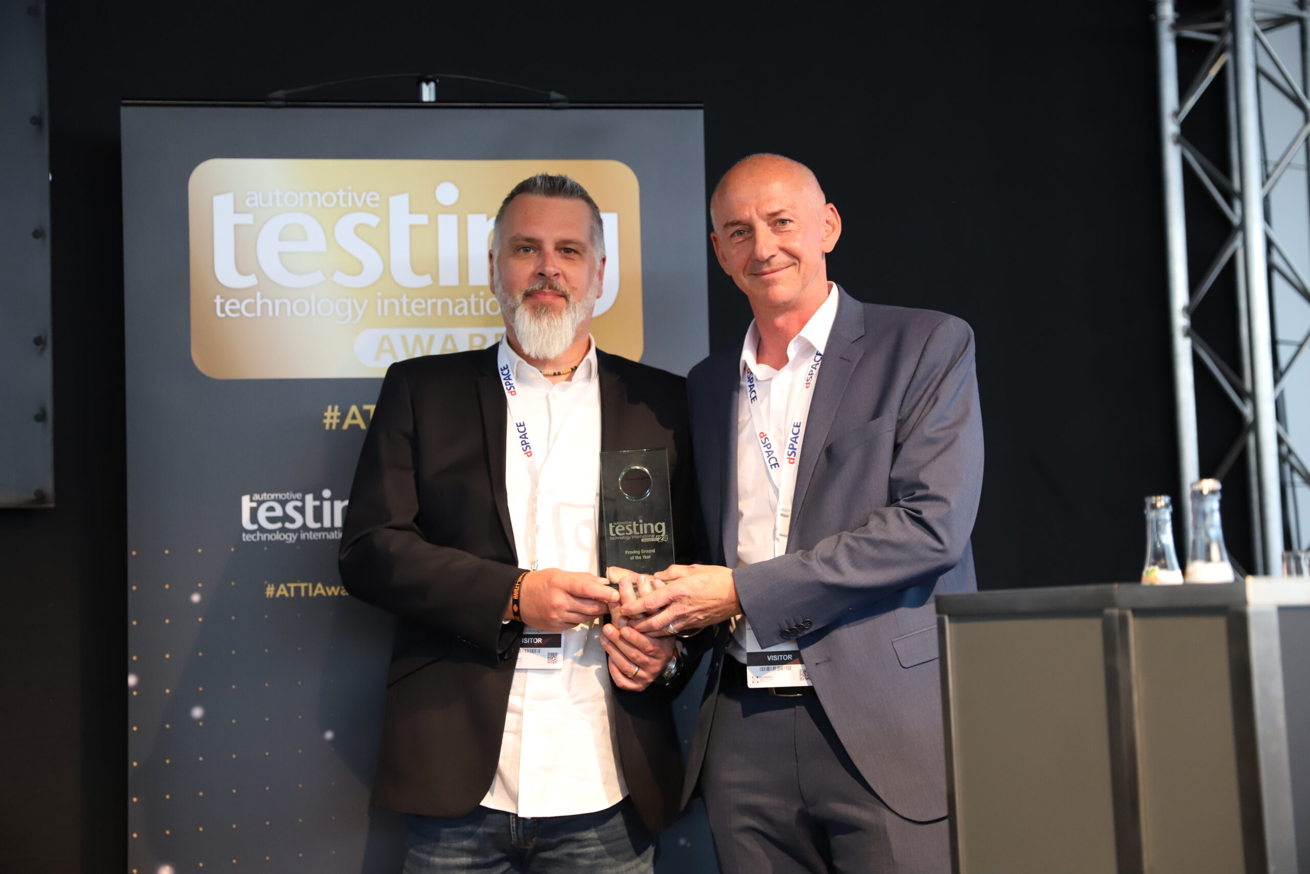 Michal Rychly (left), site manager at Sokolov and Andreas Heb (right), head of test site, infrastructure development, and overall project management for BMW Group's Future Mobility Development Centre collect their trophy at the ATTI Awards ceremony on June 5, 2024